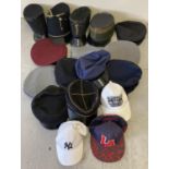 A box of assorted vintage and costume peaked hats and caps.