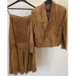 A 1980's womens tan suede skirt suit. A short jacket with two button fastening together with a fit