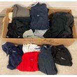A box of assorted mens sports wear. To include: Reebok, Nike, No Fear, Donnay and Adidas.