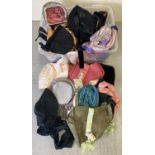 A box of assorted vintage and custom made theatre hats and bonnets. In varying styles, sizes and