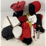 A box of assorted religious themed theatrical costume accessories.