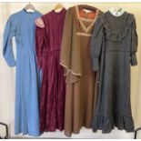 4 vintage theatre costume long sleeved dresses, in varying styles and colours.