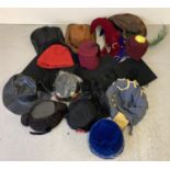 A collection of assorted vintage and theatre costume hats. In varying colours and styles.