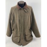 A men's green tweed field jacket by Hoggs of Fife. Front zip and press stud fastening. 4 front