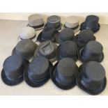 A collection of assorted vintage and modern top hats and bowler hats.