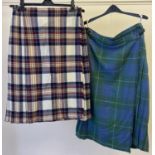 2 Scottish pure wool tartan kilts. A cream, maroon and blue kilt with leather and buckle