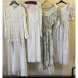 4 vintage theatre costume dresses, 2 with floral pattern and 1 with lace overlay detail.