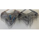 2 heavily beaded black net shoulder coverings, with bead tassels to both. One with black and