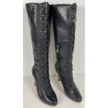 A pair of black leather River Island stiletto healed knee high boots. With zipped sides, smooth &