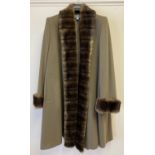 A Mansfield ladies cashmere swing coat with fur trimmed collar and cuffs. Size 12, complete with