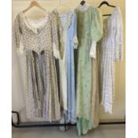 4 vintage theatre costume period dresses with frilled and floral detail.