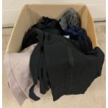 A large box of assorted mens trousers.