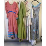 4 vintage theatre company period style costumes, 3 dresses and a 2 piece outfit. In varying