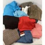 A box of vintage 1970's ladies trousers in varying designs and colours, mostly flare style. To