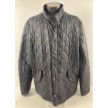 A mens black quilted jacket by Barbour. Zip and press stud fastening with 3 front pockets and 2