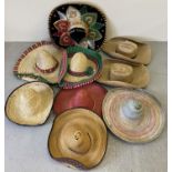 A collection of assorted cowboy and sombrero style hats.