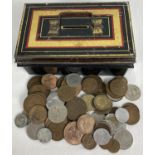 A small vintage metal cash tin with carry handle, containing a collection of vintage British and