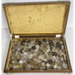 A wooden box containing a collection of antique and vintage British and foreign coins. To include