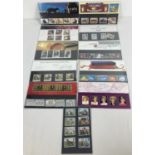 10 assorted Royal Mail Mint stamp presentation packs together with 4 carded & covered stamp sets. To