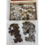 A small box of assorted vintage foreign and empire coins. To include: sovereign heads of George V,