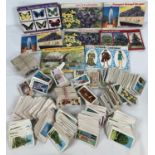 A collection of vintage tea card albums and loose teas cards in various themes. To include