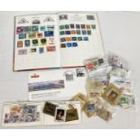 A vintage stamp album of assorted mid century world stamps together with a quantity of loose stamps,