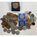 A collection of assorted vintage British and Commonwealth coins to include commemorative crowns.