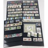 4 pages (3 double sided) of 1980's stamp sets to include sealed 1980 International stamp