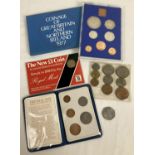 4 vintage coin sets. A cased 1977 coinage of Great Britain proof set, a sealed uncirculated 1983 £