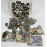 A collection of vintage foreign coins and bank notes. To include examples from India, Germany,