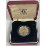 A boxed Royal Mint 1983 silver proof £1 coin complete with protective clear case.