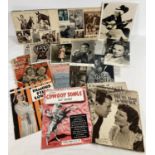 A collection of vintage film related magazines, newspaper cuttings, promotional photographs and a