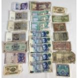 A collection of 23 foreign bank notes in varying sizes and conditions. To include examples from