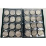 A folder containing 72 assorted white metal coins from around the world. Folder approx. 21cm x 15cm.