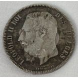 An antique silver Leopold III Belgium 5 Franc coin, dated 1869. Reverse shows signs of coin once