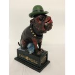 A painted cast iron mechanical bank "Ole Puffer" with glass eyes. Moving head, mouth, hat and