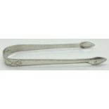 A pair of Georgian silver sugar tongs with engraved detail. Full hallmarks although no town assay,