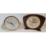 2 mid century Metamec wind up mantel clocks. A wooden fronted clock with brass feet and gold