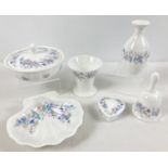 A small collection of Wedgwood ceramics in Angela pattern. To include lidded trinkets and bud vases.