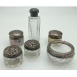 A collection of antique & vintage silver topped small vanity pots, all hallmarked. To include 2