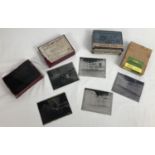 A small collection of assorted vintage glass photographic slides.