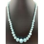 An 18" costume jewellery necklace of pale blue graduating Malay Jade beads. With silver tone S