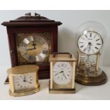 4 vintage Metamec quartz clocks. To include a wooden cased brass faced mantel clock, an small gold