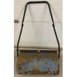 A metal hand held manual garden roller, painted blue. Length of roller approx. 57cm.
