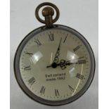 A top winding glass ball watch, bound in brass with roman numeral markers. Approx. 6cm diameter.