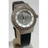 A women's Fossil Big Tic JR-7926 stone set wrist watch with black leather strap. With clear stone