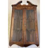 A vintage mahogany wall hanging corner cupboard with glazed panelled doors. Complete with 2 interior