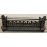 A Victorian cast iron fire grate front with decorative pierced galleried sides. Approx. 22cm tall