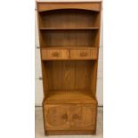 A retro 1970's oak effect wall unit with 2 shelves, 2 drawers and a double cupboard to base with