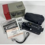 A boxed vintage Canon Auto Zoom 318M cine camera complete with instructions. Original paperwork,